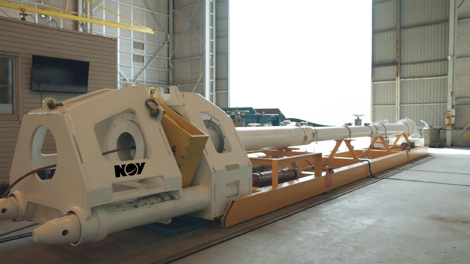A subsea automated pig launcher waiting for deployment inside a warehouse