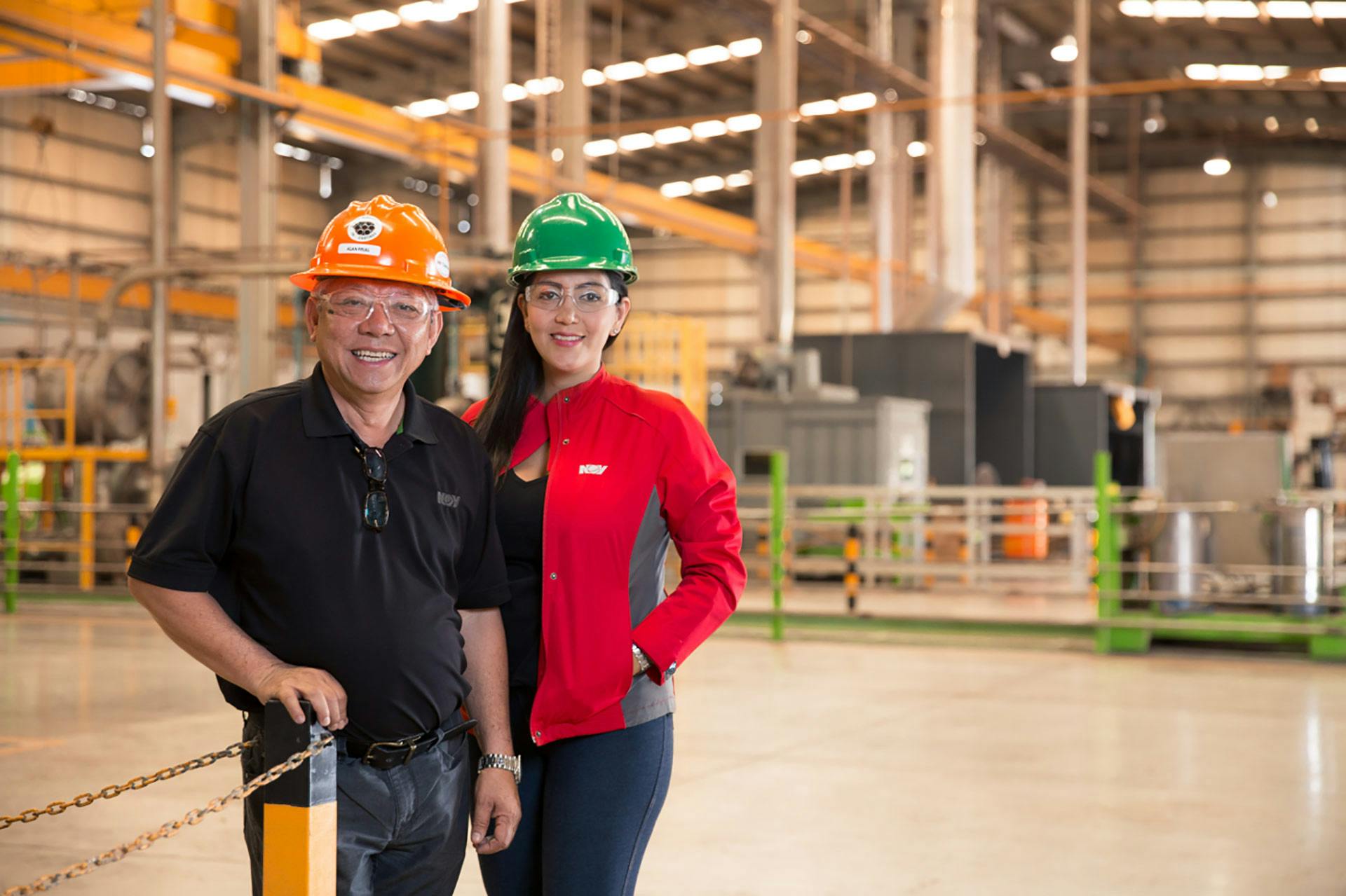 2 employees standing in a warehouse