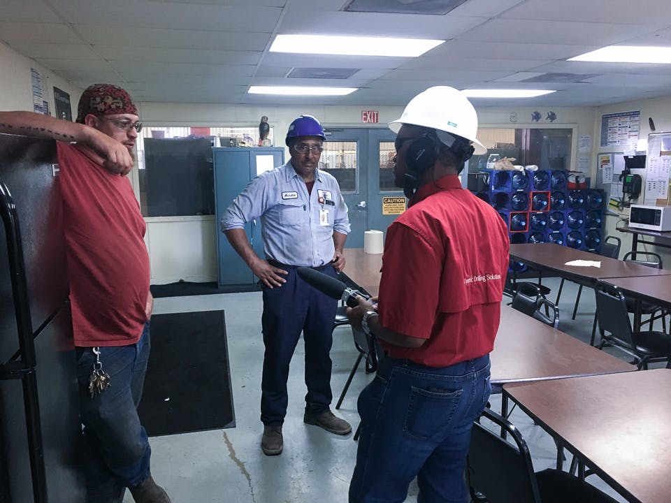 Michael Gaines interviewing two employees in a break room at the Grant Prideco facility in Navasota, TX