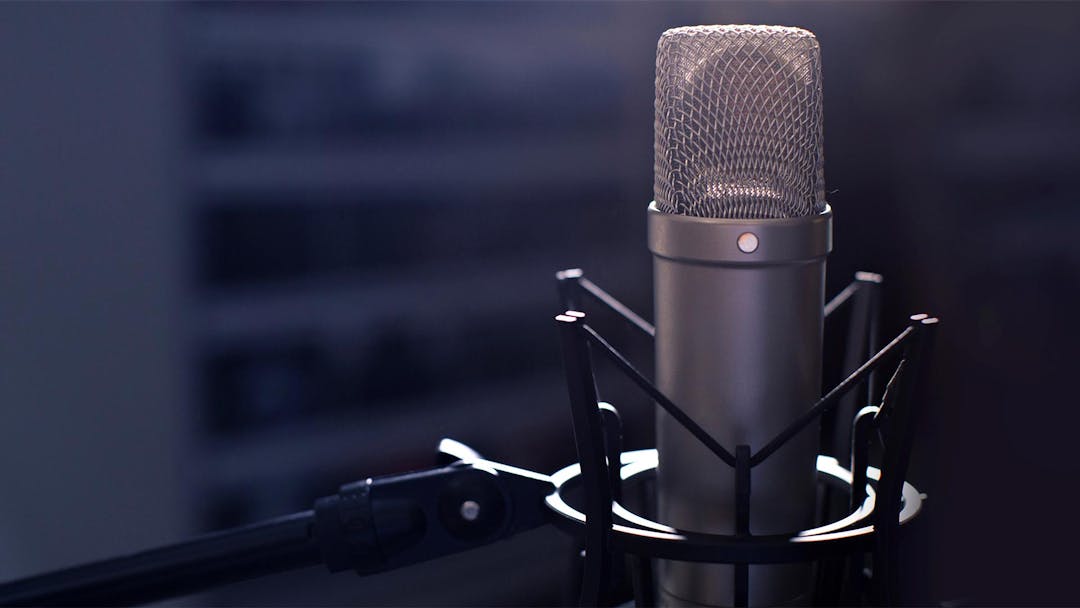A closeup of a studio microphone used for podcasts
