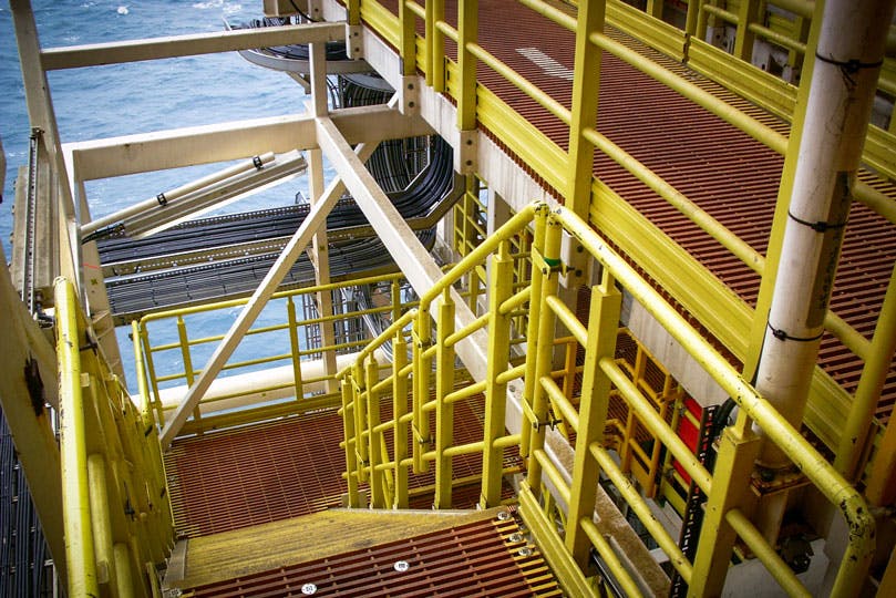 Yellow platforms and stairs on an offshore facility
