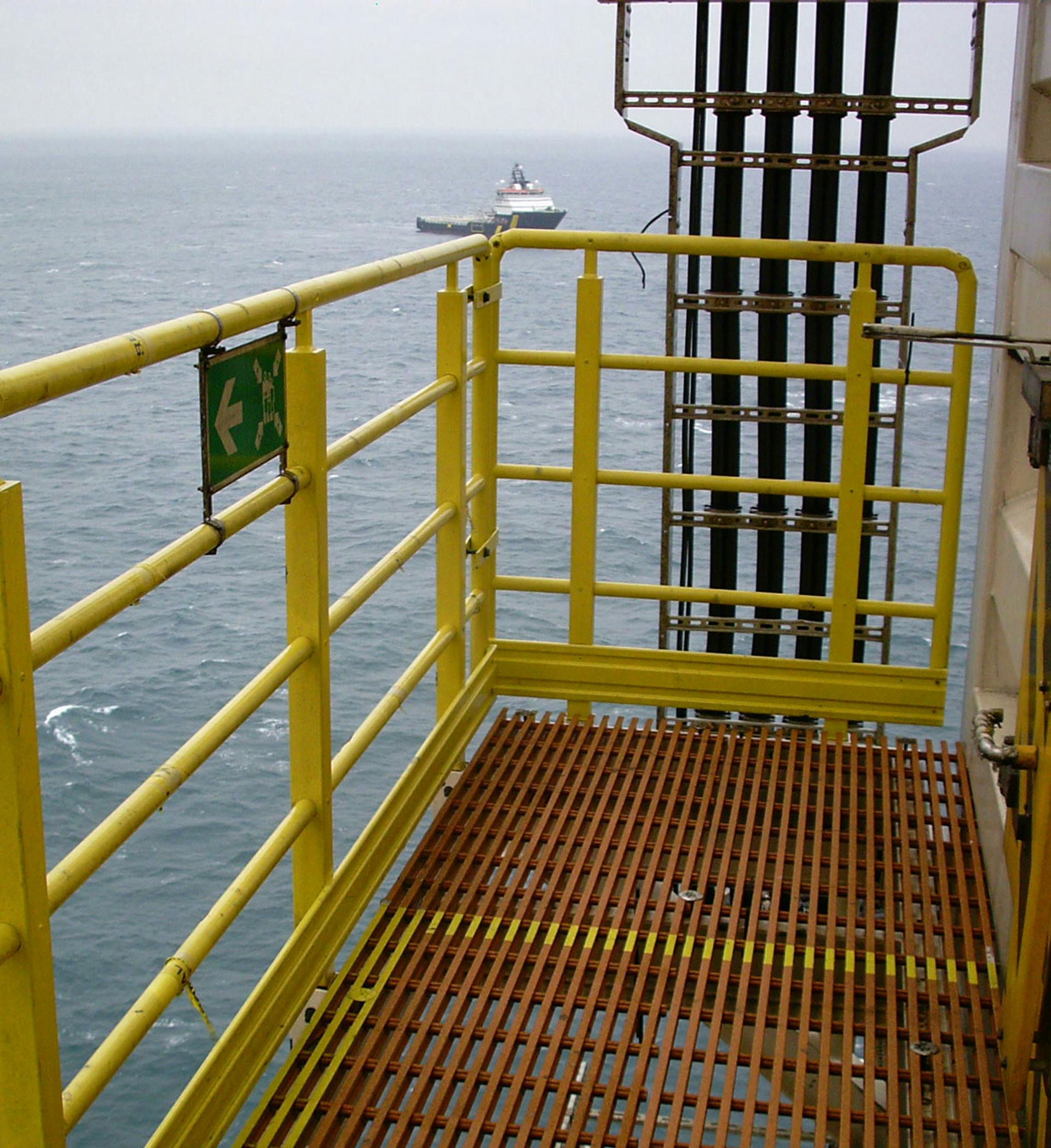 MARRS FRP handrail and phenolic grating, with ocean in the background