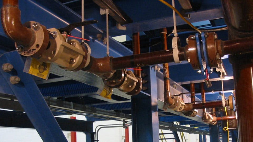 A copper Centricast Fiberglass Piping system lining a ceiling