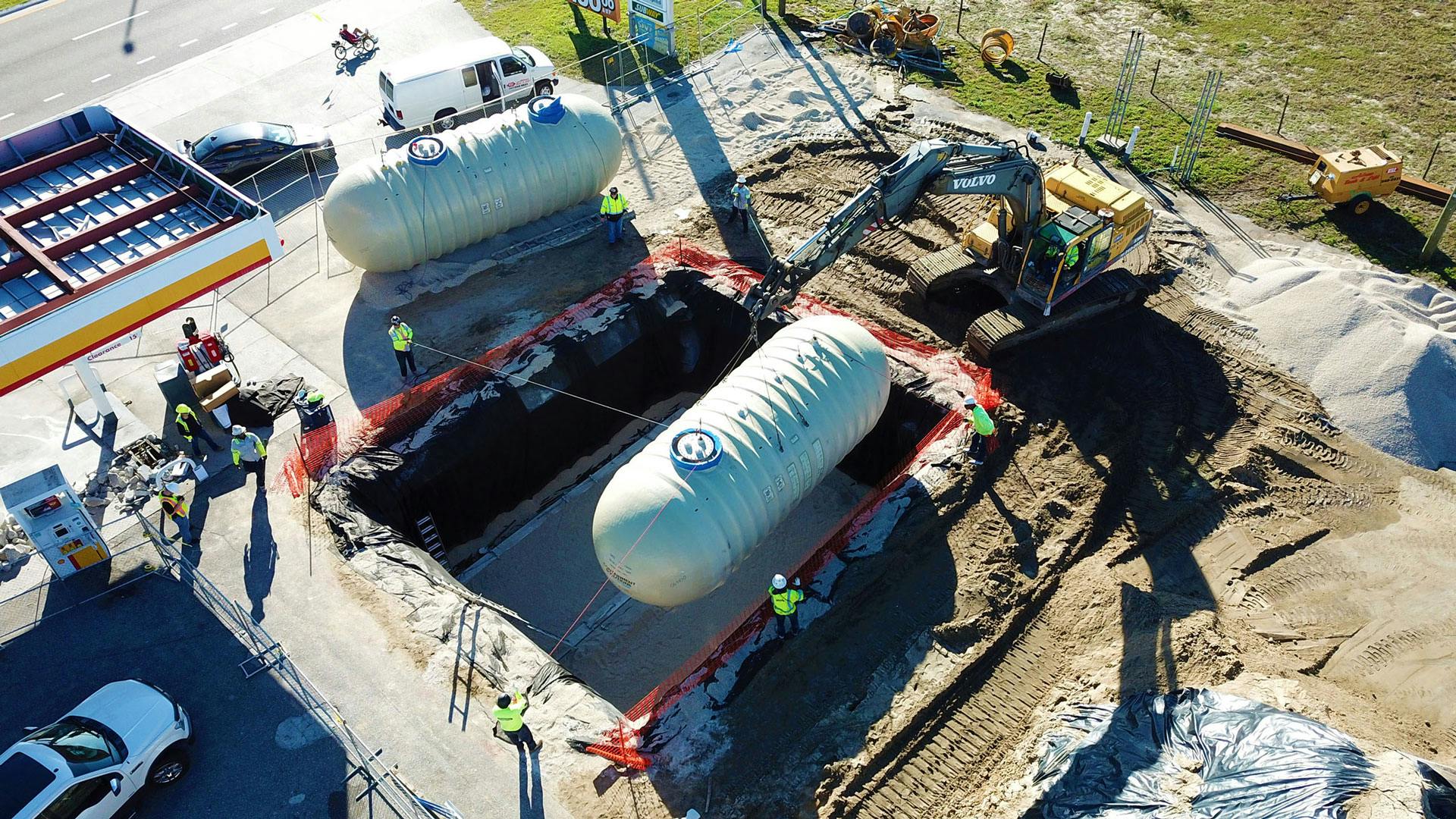 Aerial view of fiberglass tanks on gas station job site.