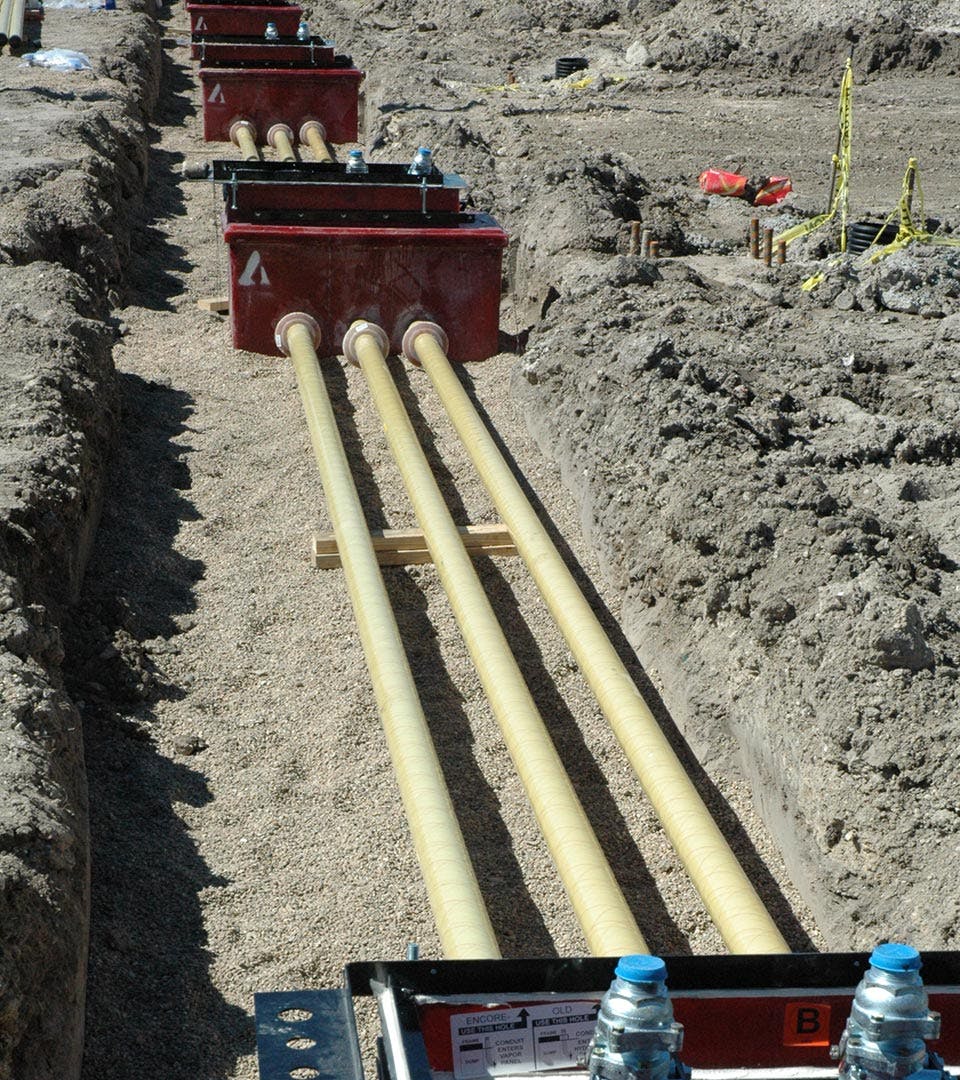Above angled view of Red Thread IIA Fiberglass Pipe in a ditch