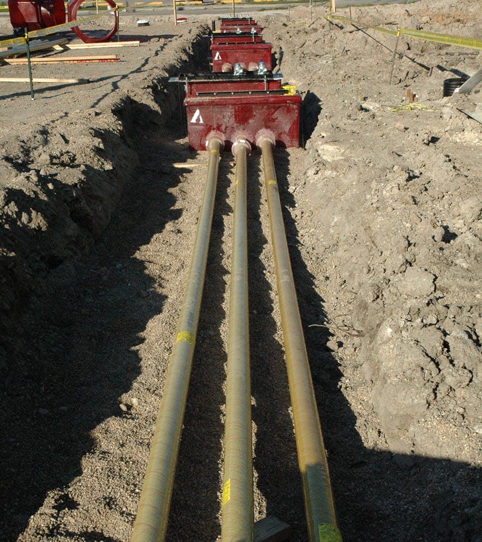 Above view of Red Thread IIA Fiberglass Pipe in a ditch
