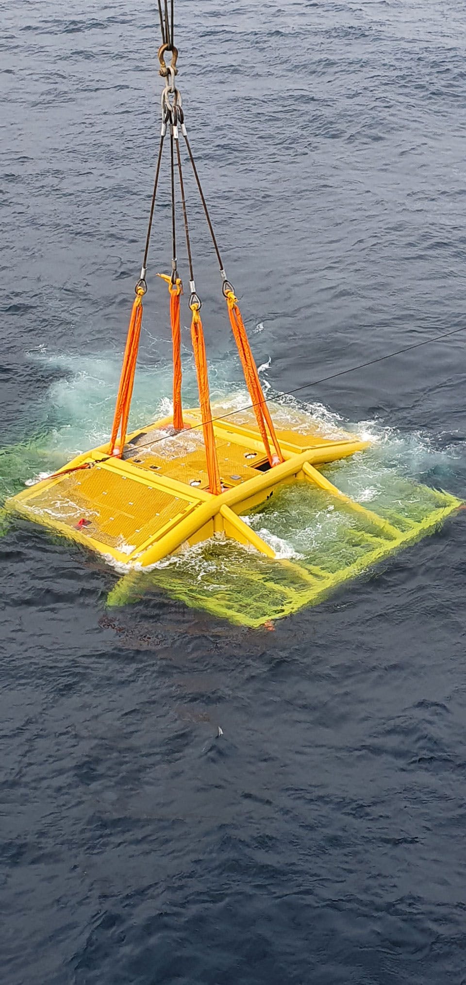 Deployment of subsea manifold as it's being submerged in water