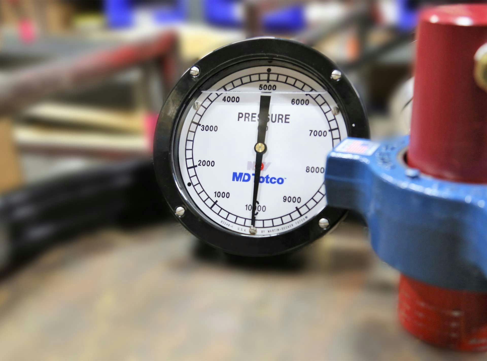 A pressure indicator attached to a piece of equipment