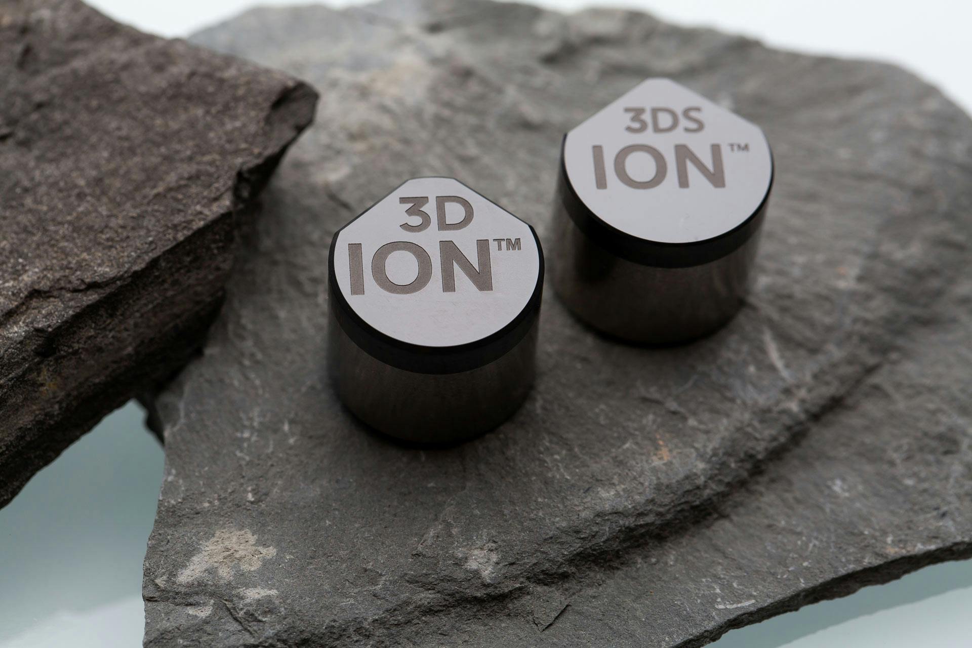 An ION 3D and an ION 3DS Cutter rest on a rock
