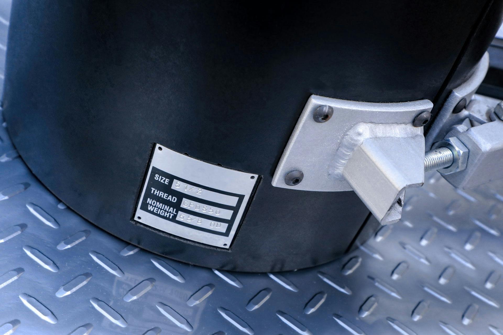 close up of plate on a black heavy duty roughneck stabbing guide