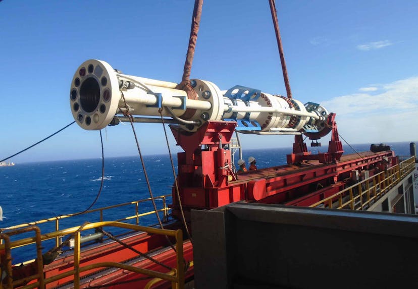 Image of drilling part being lifted, offshore