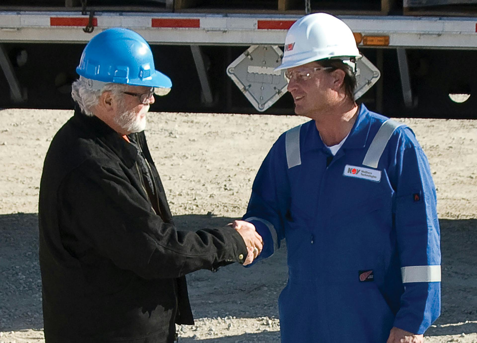 Power Generation Solutions technician shaking hands with a client